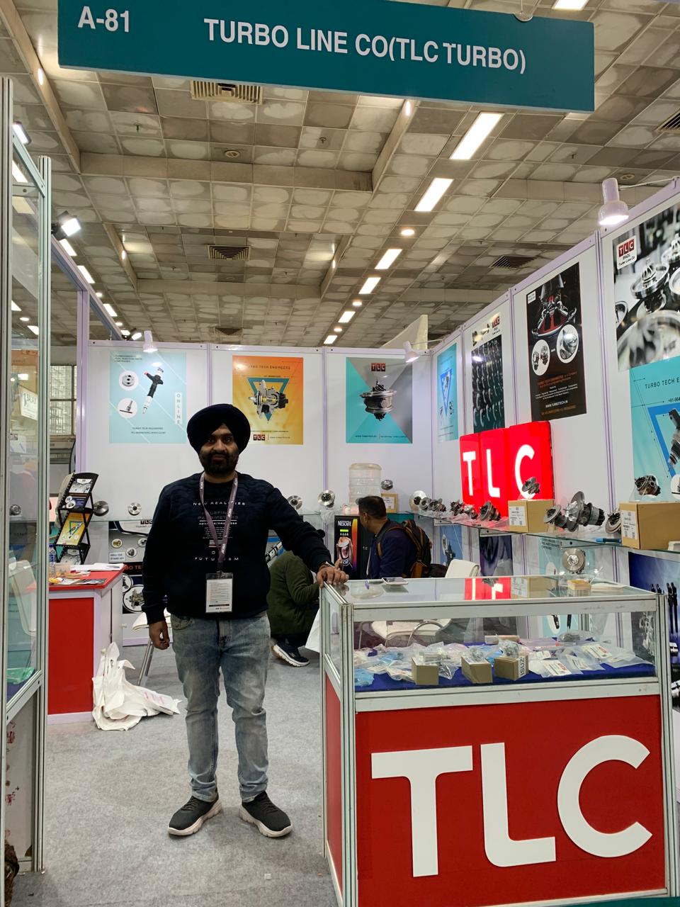 Turbo Tech Engineers exhibition booth displaying turbocharger and fuel injector products